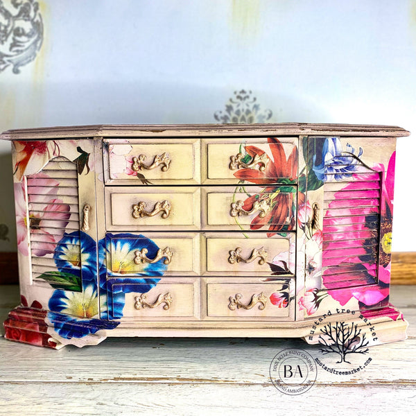 A vintage large dresser refurbished by Mustard Tree Market, a Dixie Belle Paint Company Brand Ambassador, is painted beige and features the Whimsical Wonderland Transfer on it.