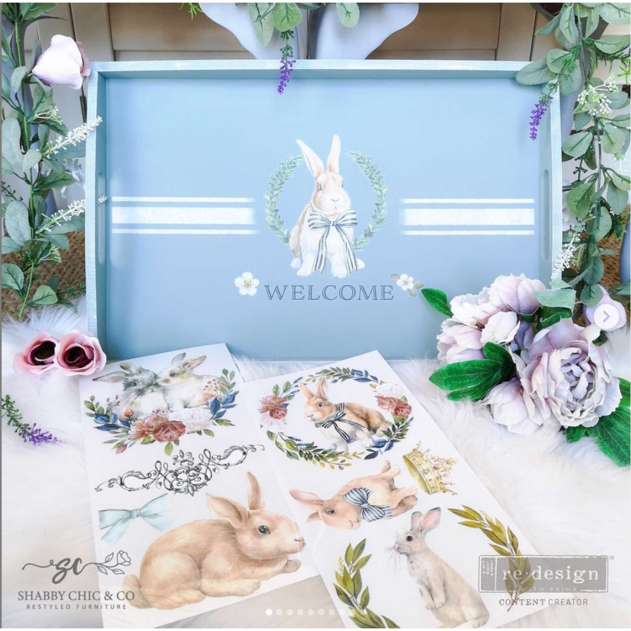 Blue tray with the Cottontail transfer on top with two sheets of the Cottontail transfer sat next to it. A grey Shabby Chic & Co restyled furniture on the bottom left, A Redesign content creator logo on the bottom right.