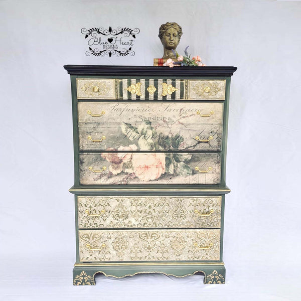 A vintage chest dresser refurbished by Blue Heart Designs features the Sandrina rice paper on its drawers.