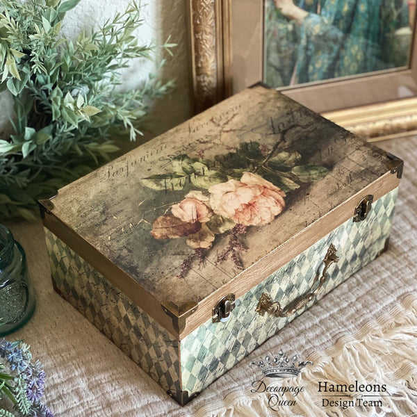 A small wood box refurbished by Hameleons Design Team is decorated with the Neutral Harlequin rice paper. A natural wood stain and Sandrina rice paper is on the lid.