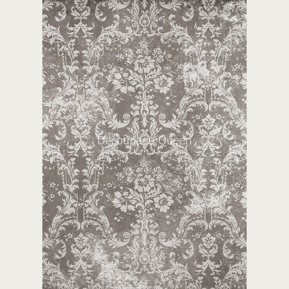 Rice paper featuring a light colored distressed floral damask design against a grey background.