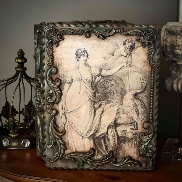Ornate decor piece with the Juno and Cupid decoupage paper on top. 