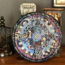 A wall clock features Decoupage Queen's Number Mosaic rice paper on top.