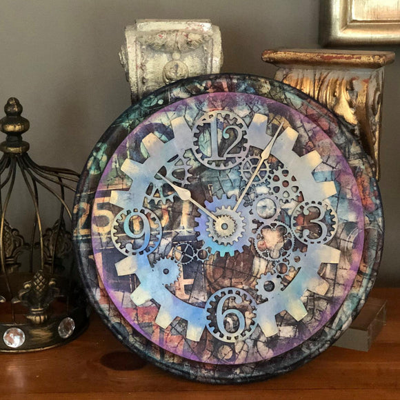 A wall clock features Decoupage Queen's Number Mosaic rice paper on top.