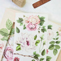 Two Delicate Roses transfer sheets on top of a wooden frame.