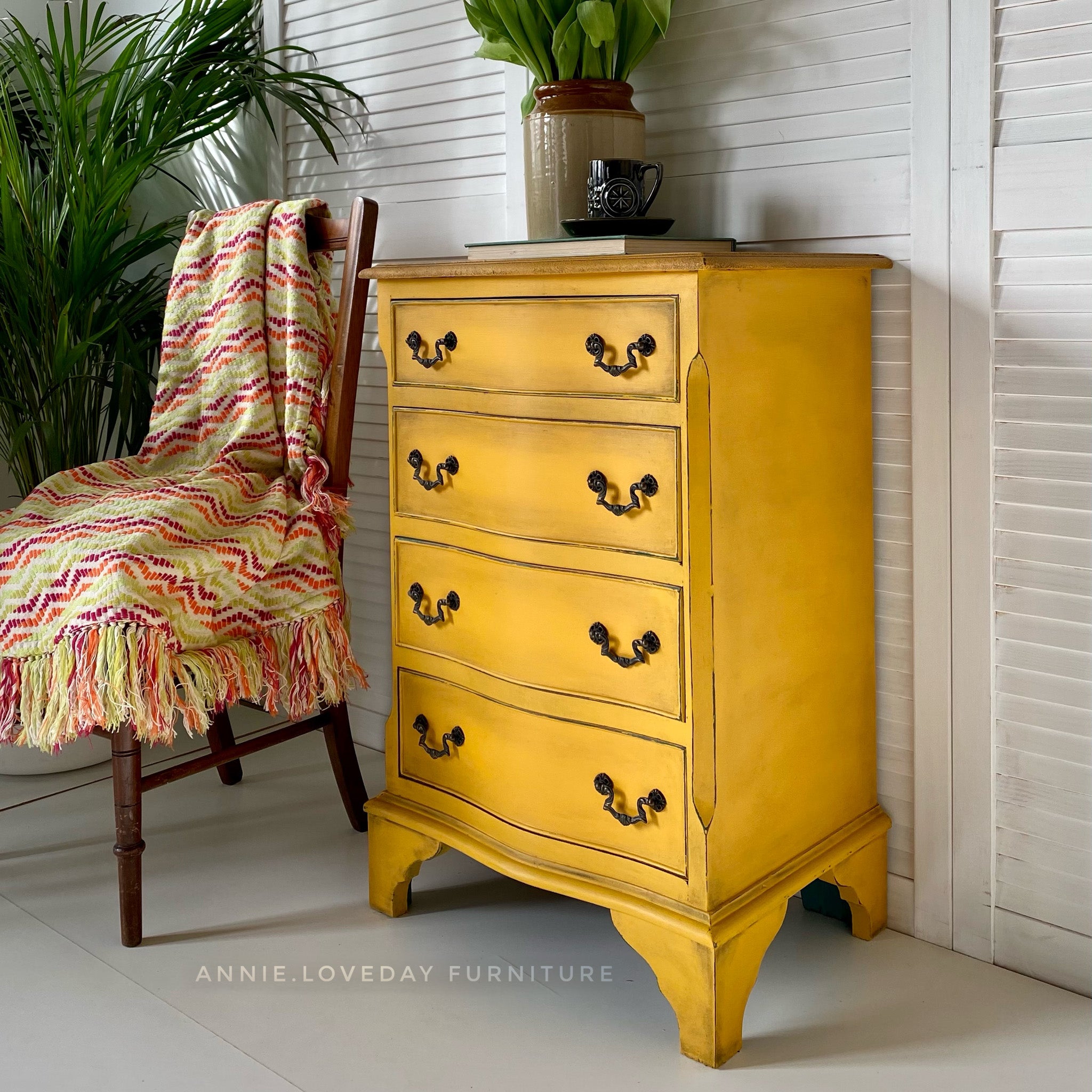 A vintage 4-drawer chest dresser refurbished by Annie Loveday Furniture is painted in Dixie Belle's Colonel Mustard chalk mineral paint.