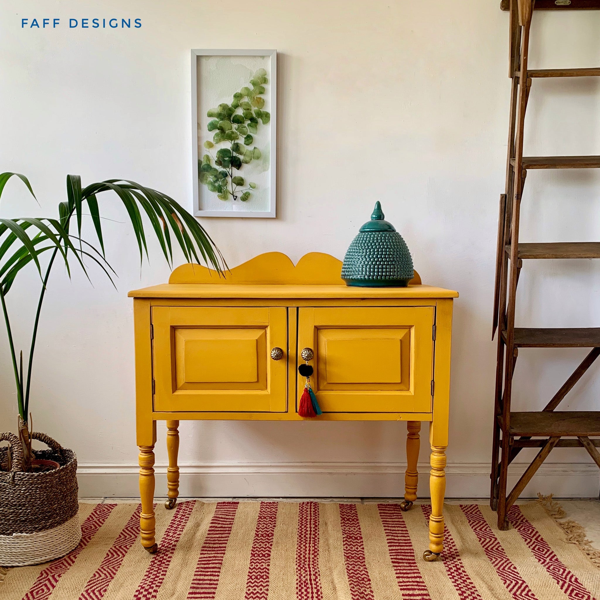 A vintage 2-door buffet table refurbished by Faff Designs is painted in Dixie Belle's Colonel Mustard chalk mineral paint.