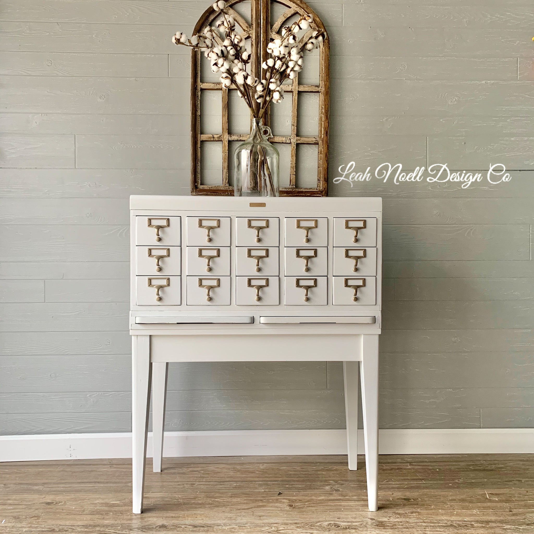 A vintage metal card cabinet refurbished by Leah Noell Design Company is painted in Dixie Belle's Cotton chalk mineral paint.