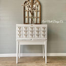 A vintage metal card cabinet refurbished by Leah Noell Design Company is painted in Dixie Belle's Cotton chalk mineral paint.