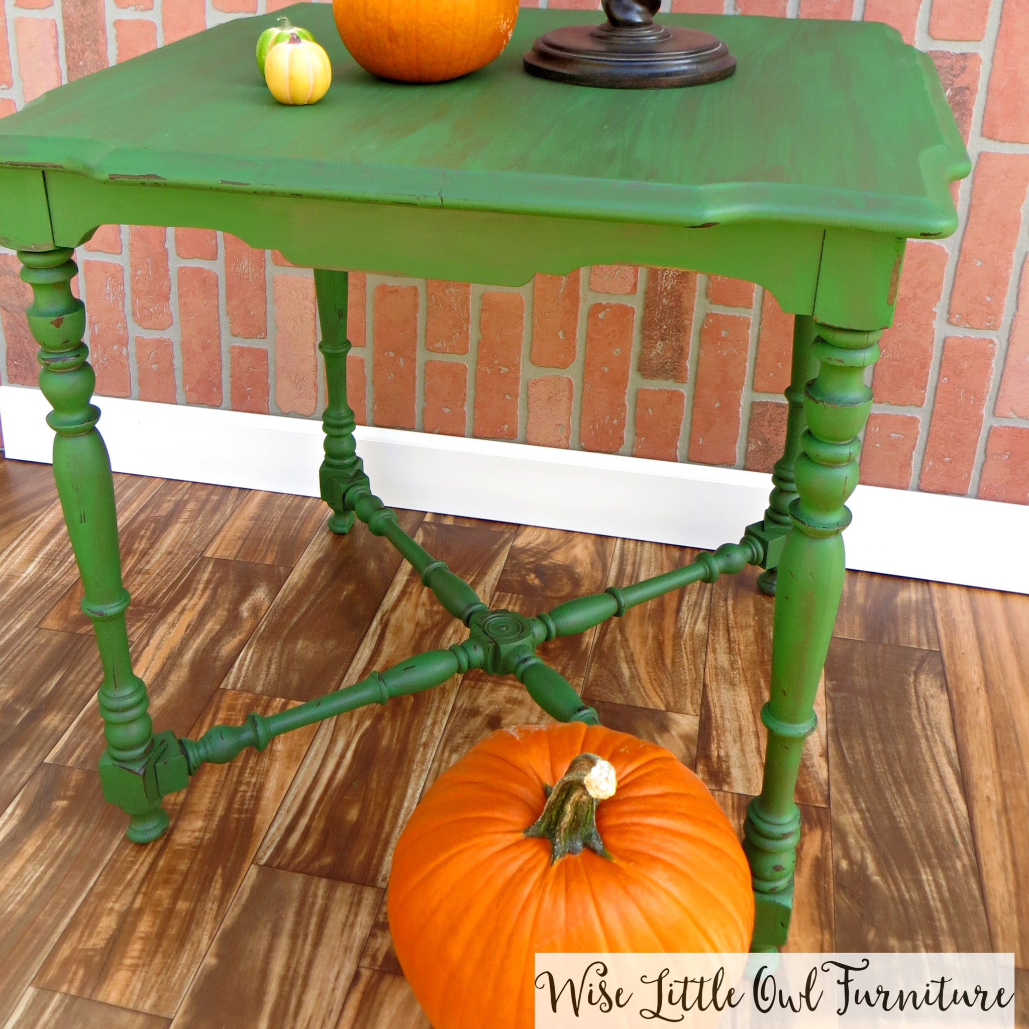 A small vintage table refurbished by Wise Little Owl Furniture is painted in Dixie Belle's Evergreen chalk mineral paint.