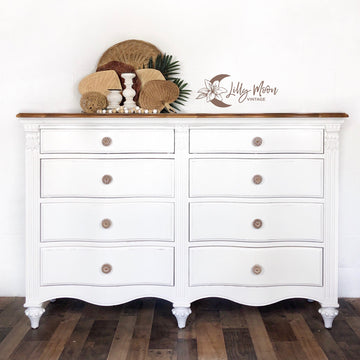 A vintage 8-drawer dresser refurbished by Lilly Moon Vintage is painted in Dixie Belle's Fluff chalk mineral paint.