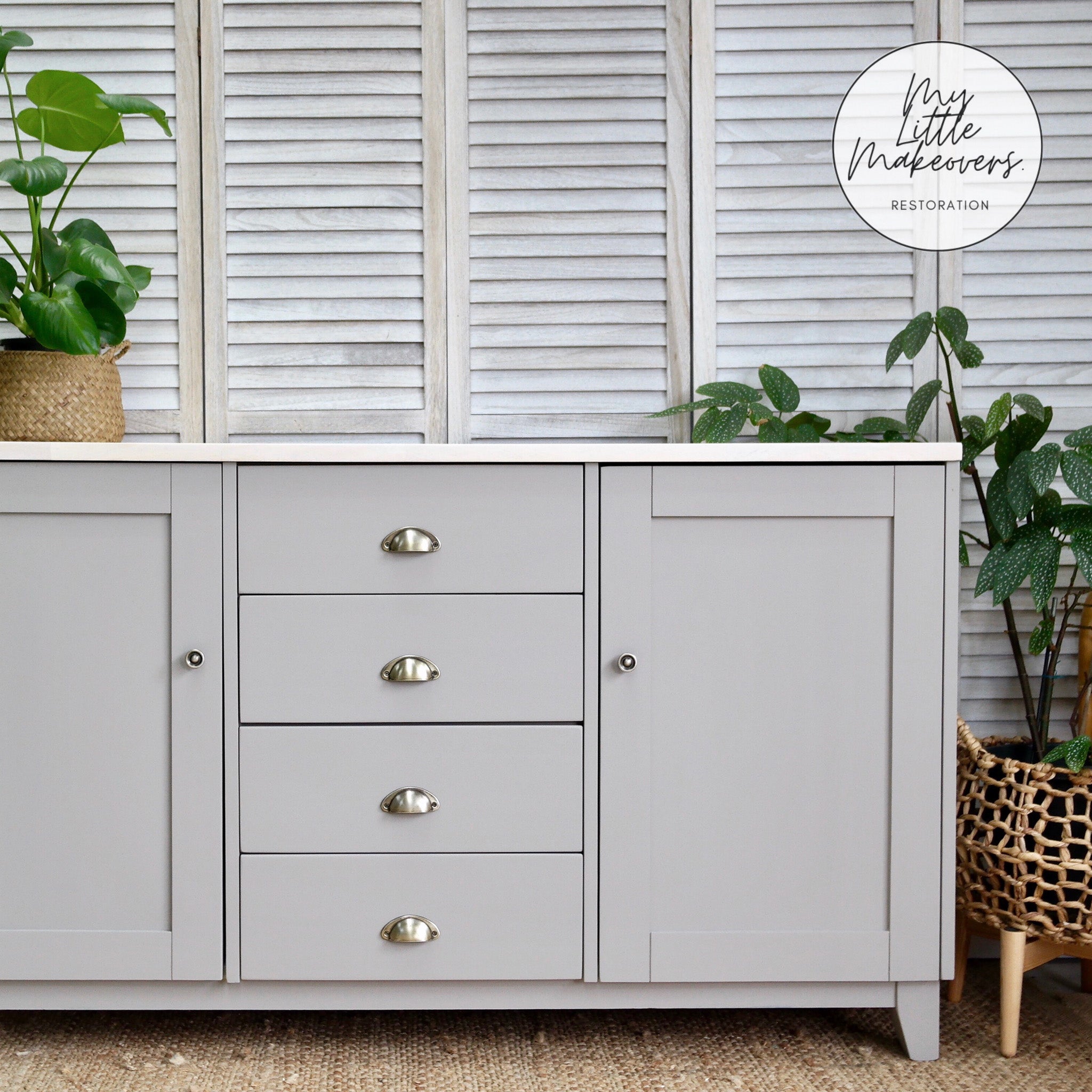 A large dresser with 4 drawer and 2 doors refurbished by My Little Makeovers Restoration is painted in Dixie Belle's French Linen chalk mineral paint.