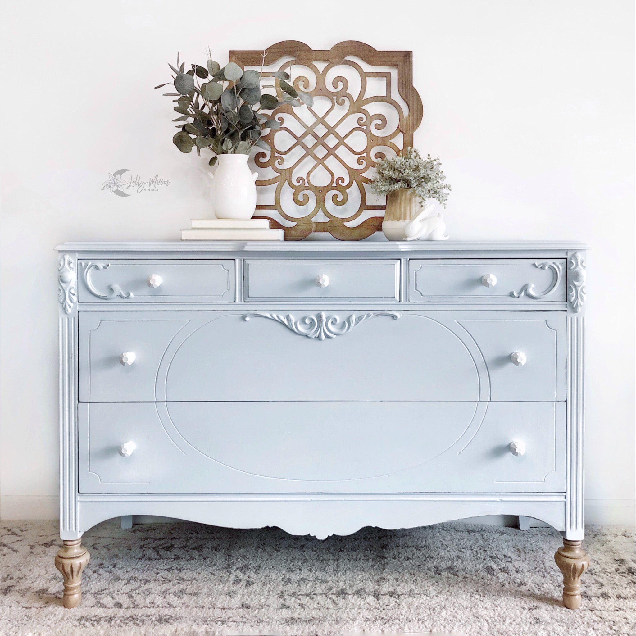 A vintage 5-drawer dresser refurbished by Lilly Moon Vintage is painted in Dixie Belle's Haint Blue chalk mineral paint.