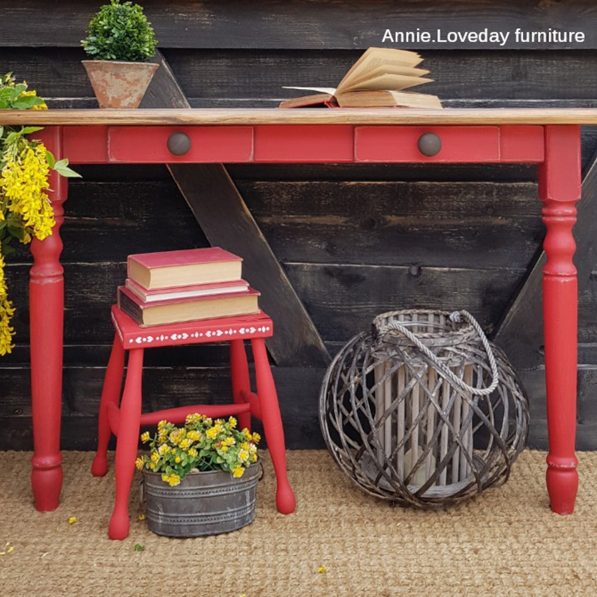 A vintage kids desk and stool refurbished by Annie Loveday Furniture are painted in Dixie Belle's Honky Tonk Red chalk mineral paint.