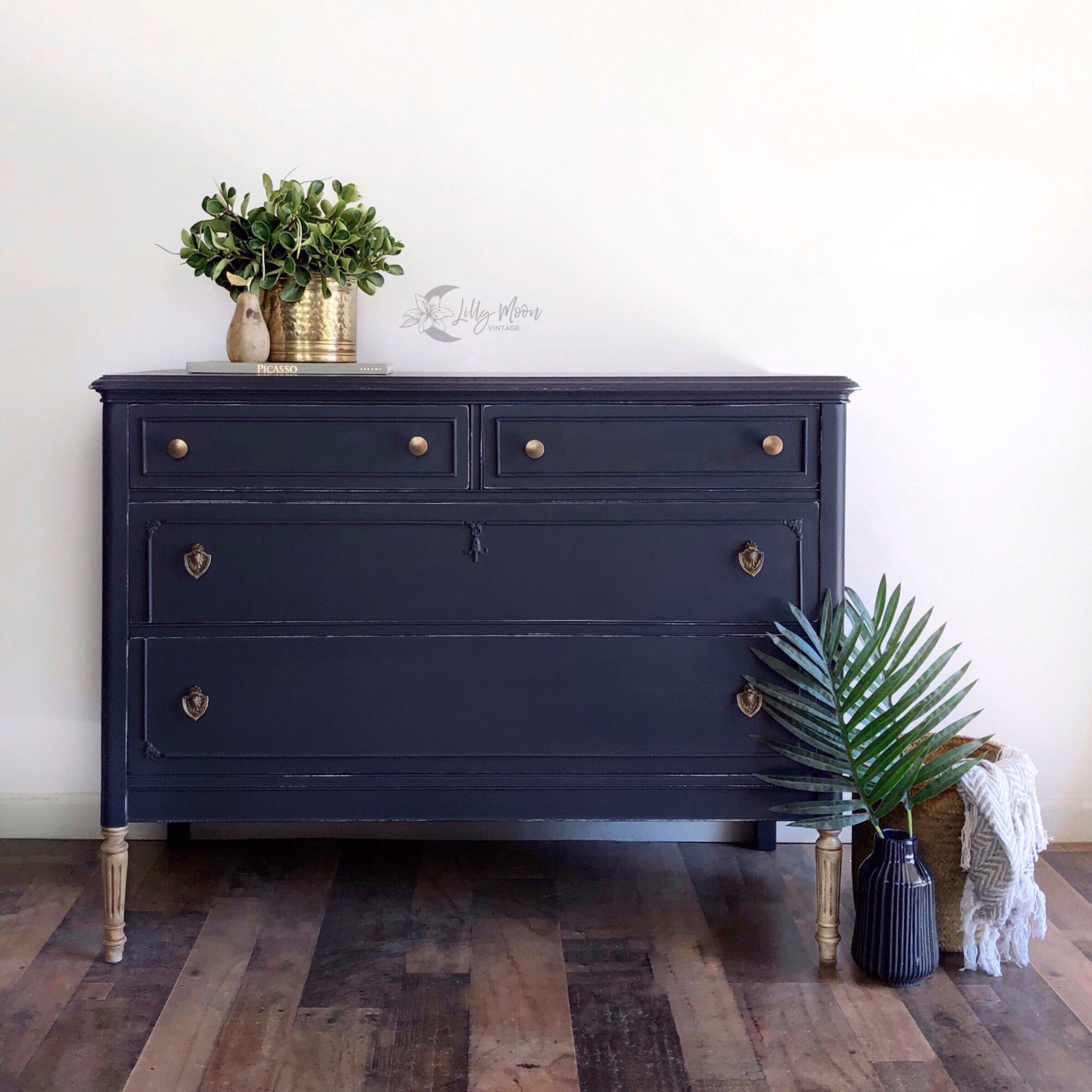 A vintage 4-drawer dresser refurbished by Lilly Moon Vintage is painted in Dixie Belle's In the Navy chalk mineral paint.
