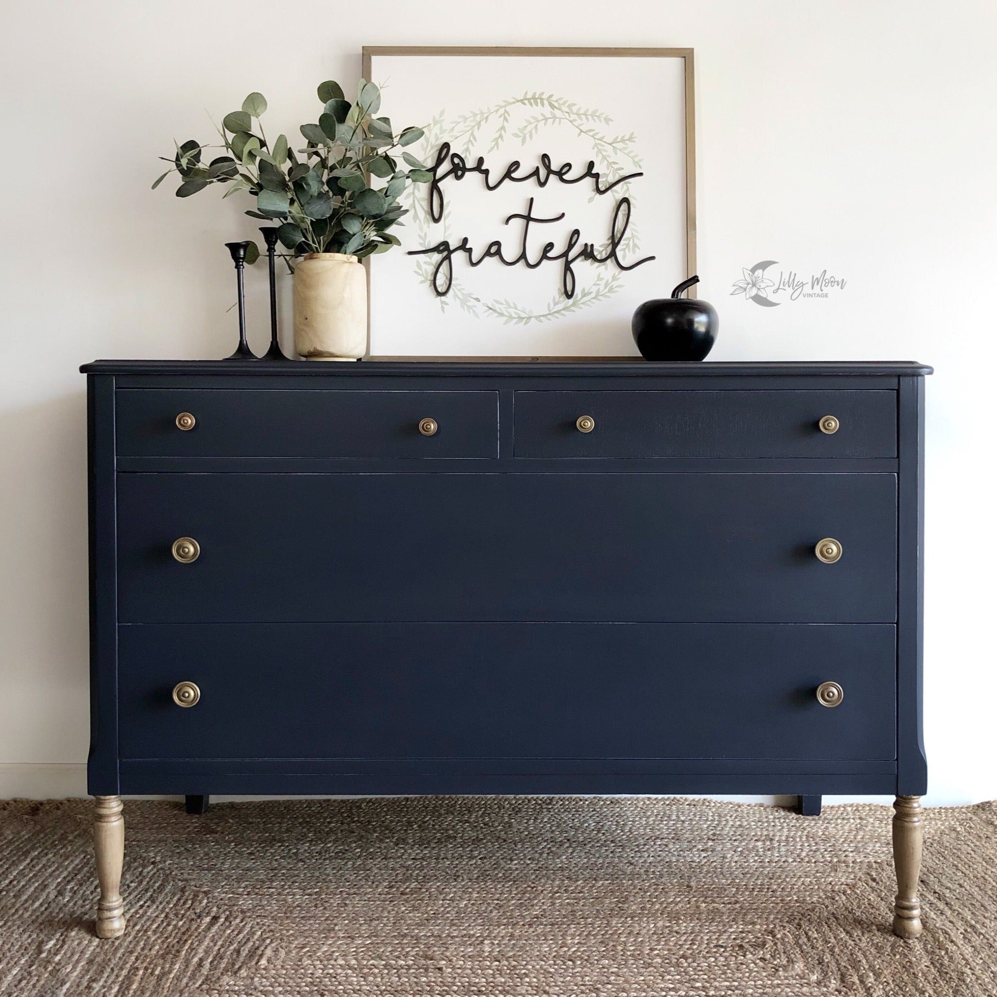 A 4-drawer chest dresser refurbished by Lilly Moon Vintage is painted in Dixie Belle's In the Navy chalk mineral paint.