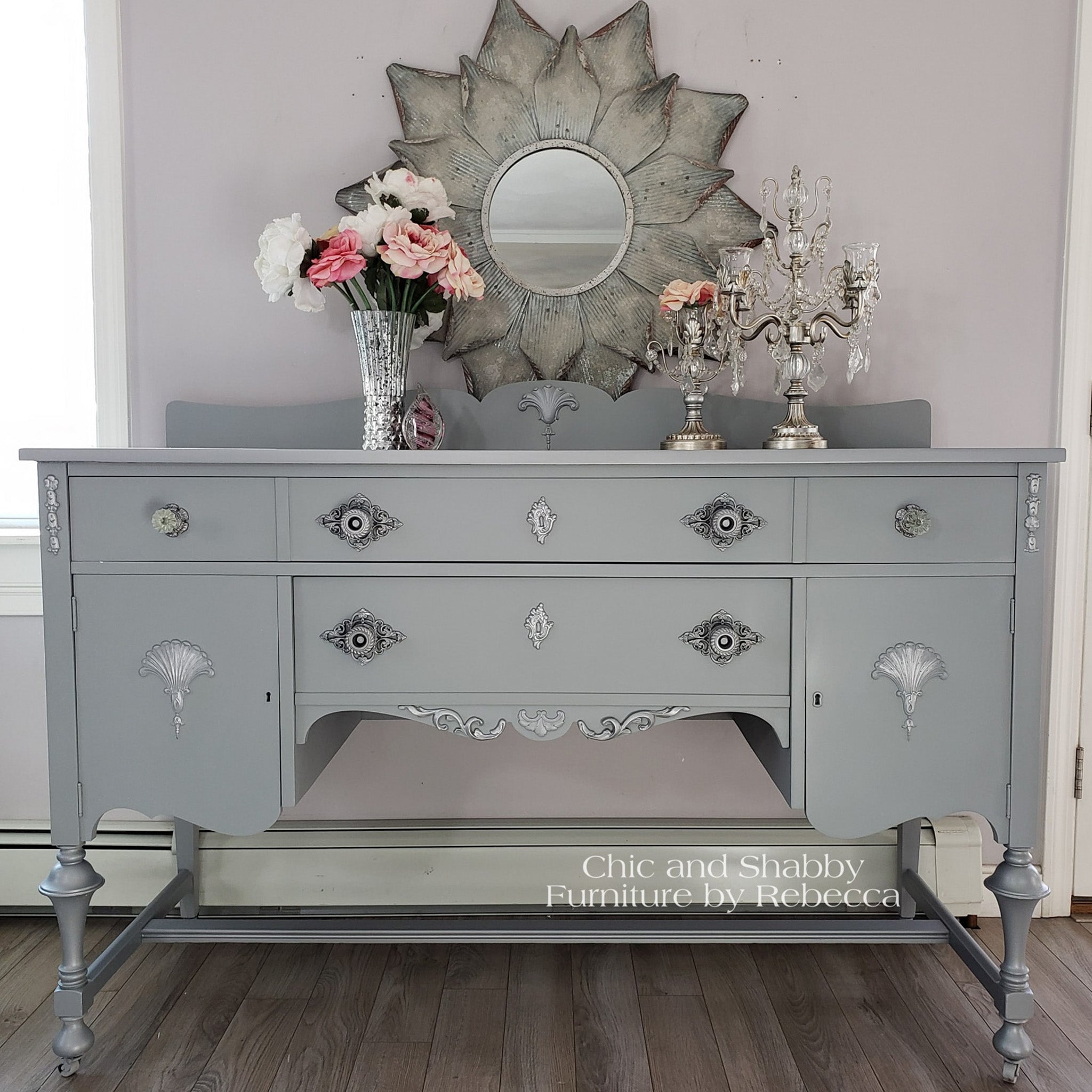 A vintage vanity refurbished by Chic and Shabby Furniture by Rebecca is painted in Dixie Belle's Manatee Gray chalk mineral paint.