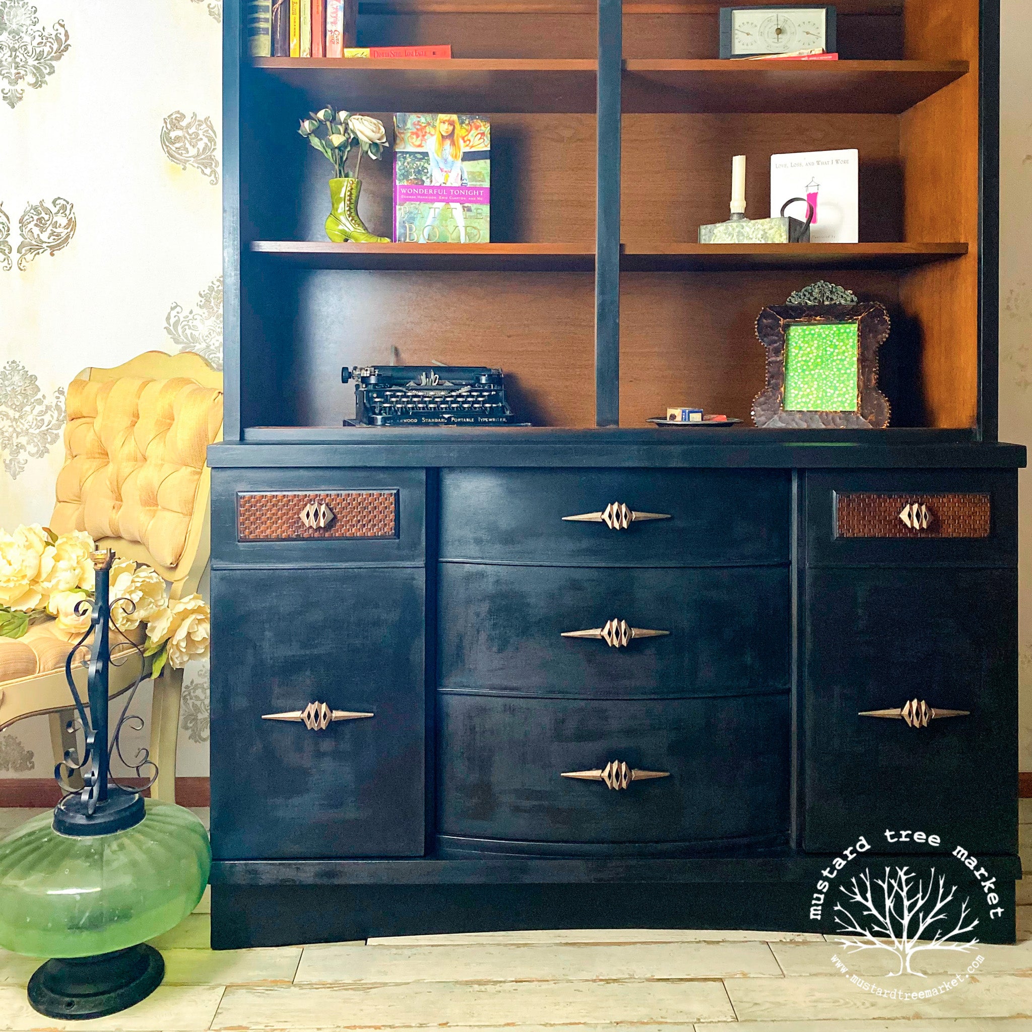 A vintage hutch refurbished by Mustard Tree Market is painted in Dixie Belle's Midnight Sky chalk mineral paint. The inside of the hutch is natural brown wood.