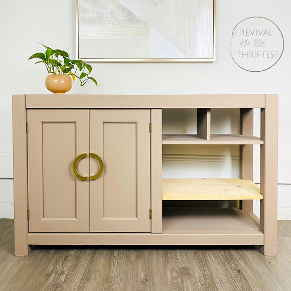 A small console table refurbished by Rivival of the Thriftest is painted in Dixie Belle's Mud Puddle chalk mineral paint.