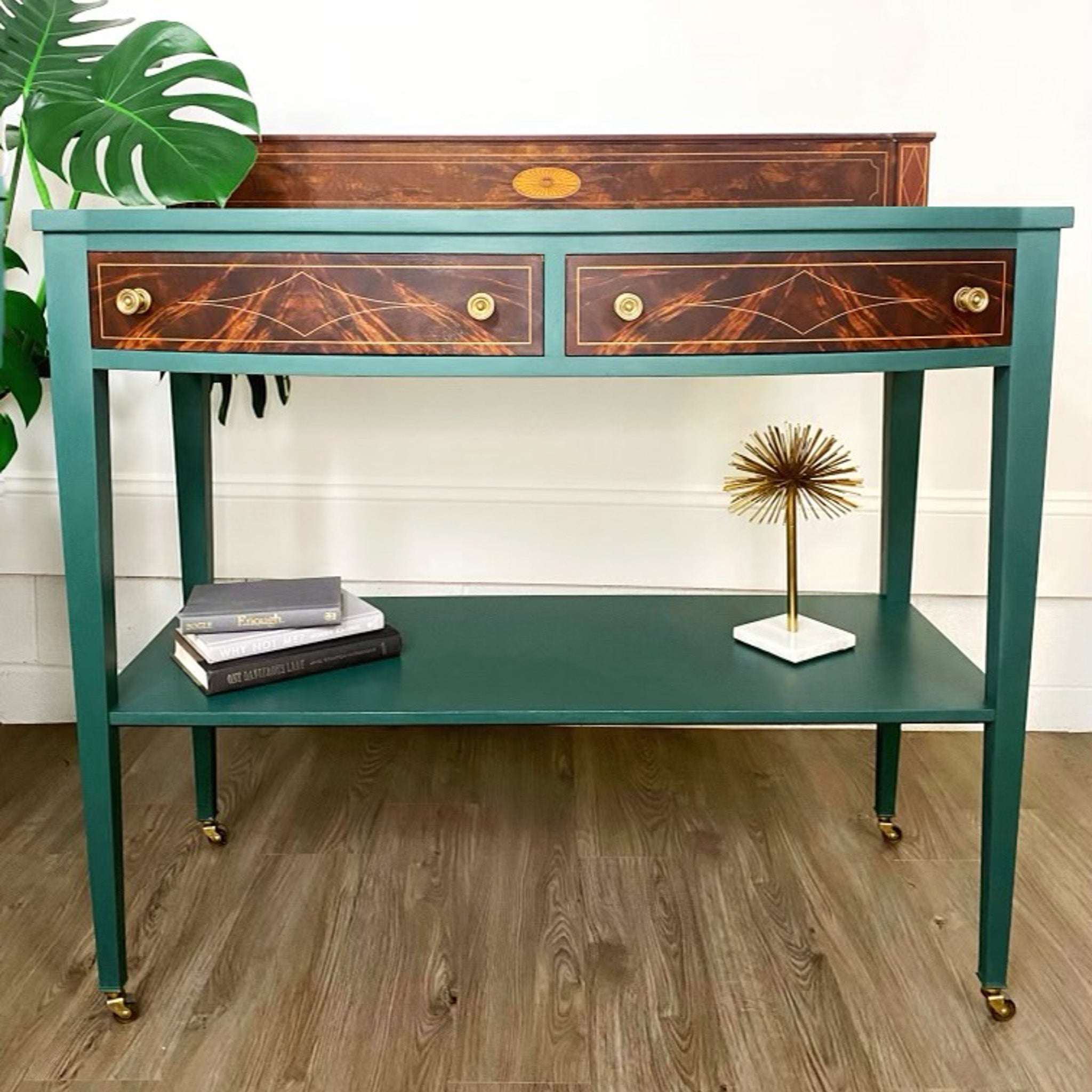 A vintage desk is painted in Dixie Belle's Palmetto chalk mineral paint and has natural wood accents.