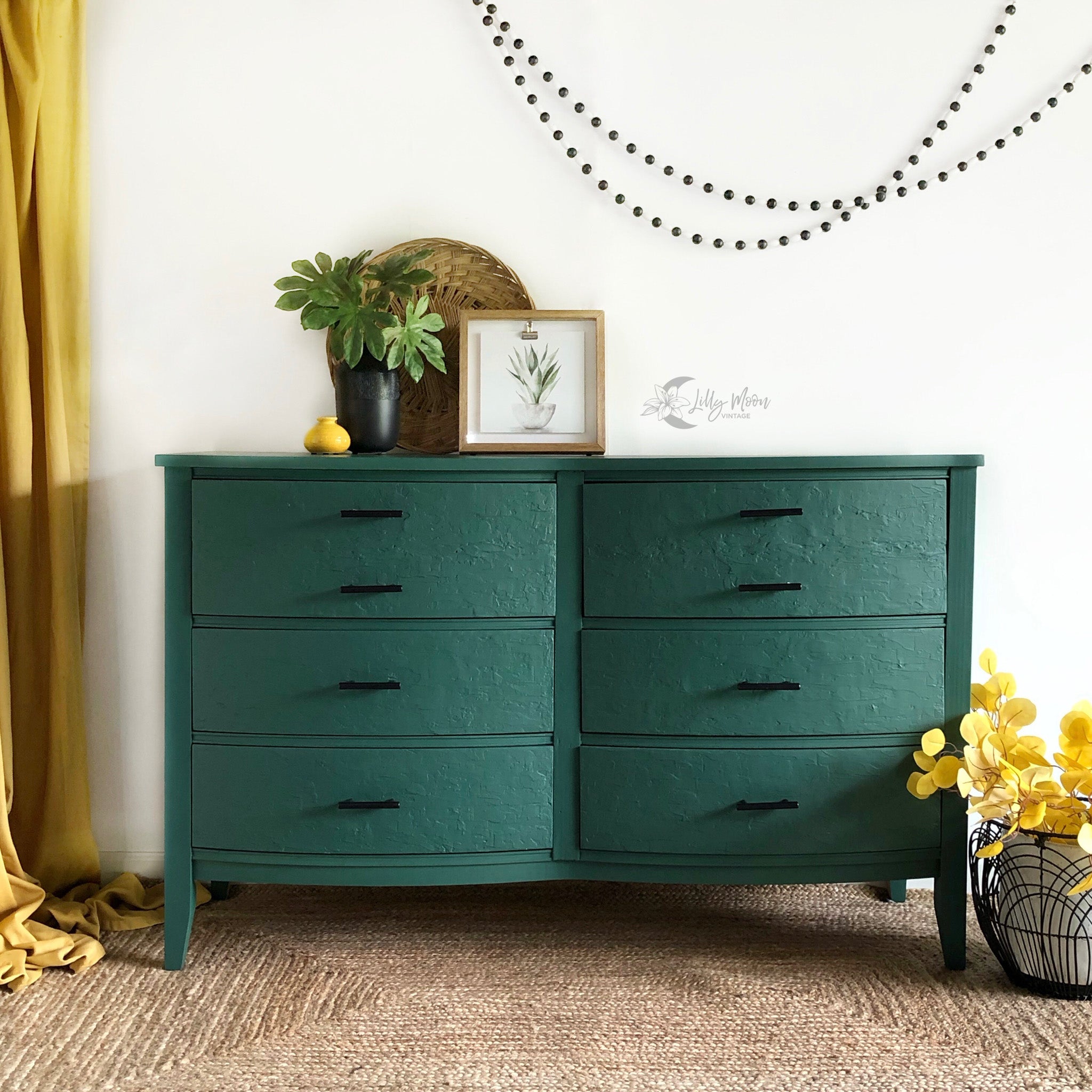 A vintage 6-drawer dresser refurbished by Lilly Moon Vintage is painted in Dixie Belle's Palmetto chalk mineral paint.