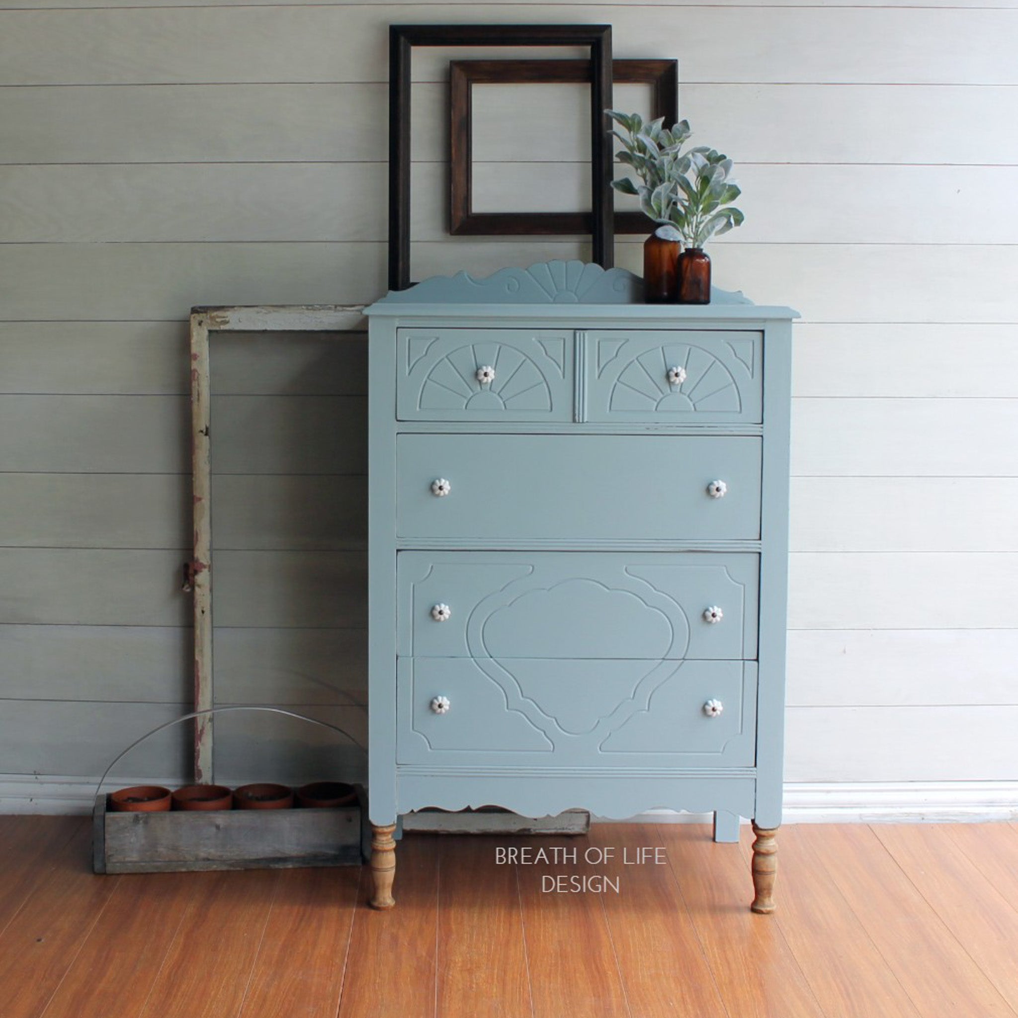 A vintage 5-drawer chest dresser refurbished by Breath of Life Design is painted in Dixie Belle's Savannah Mist chak mineral paint.