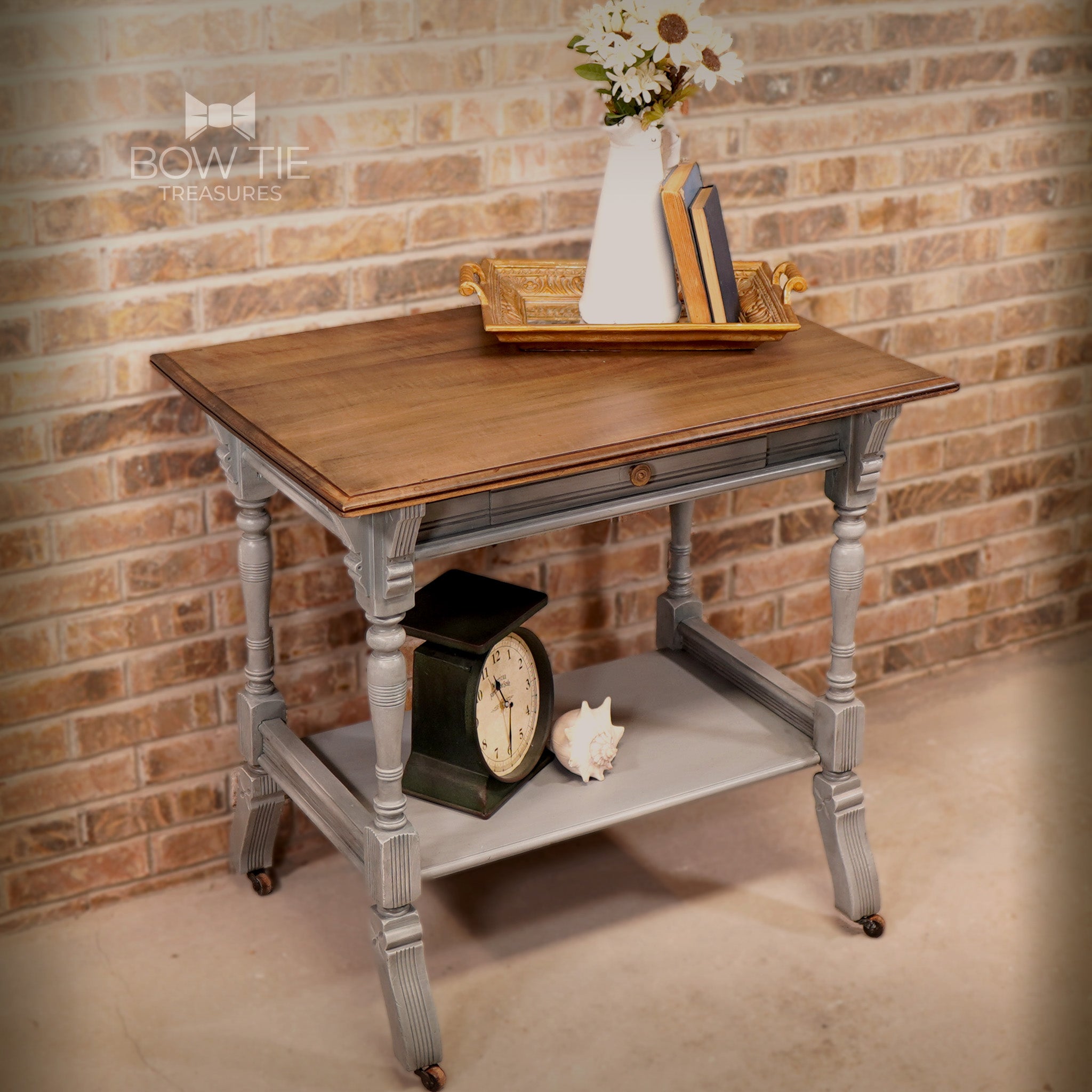 A vintage end table refurbished by Bow Tie Treasures is painted in Dixie Belle's Sawmill Gravy chalk mineral paint and has a natural wood top.