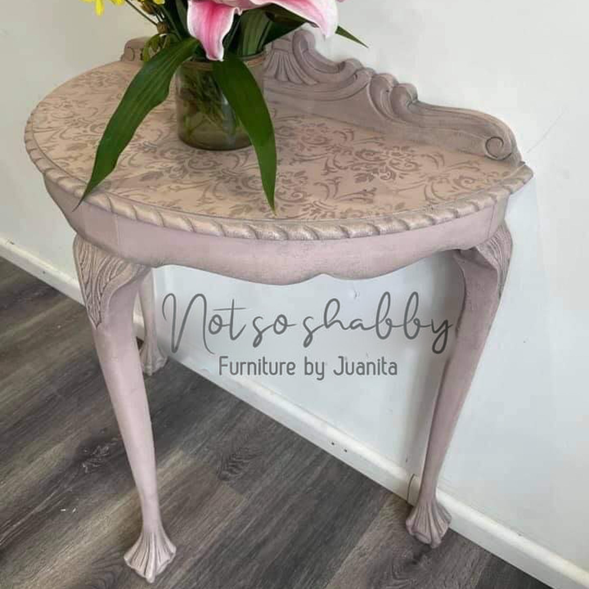 A vintage half-circle side table refurbished by Not so Shabby Furniture by Juanita is painted in Dixie Belle's Soft Pink chalk mineral paint.