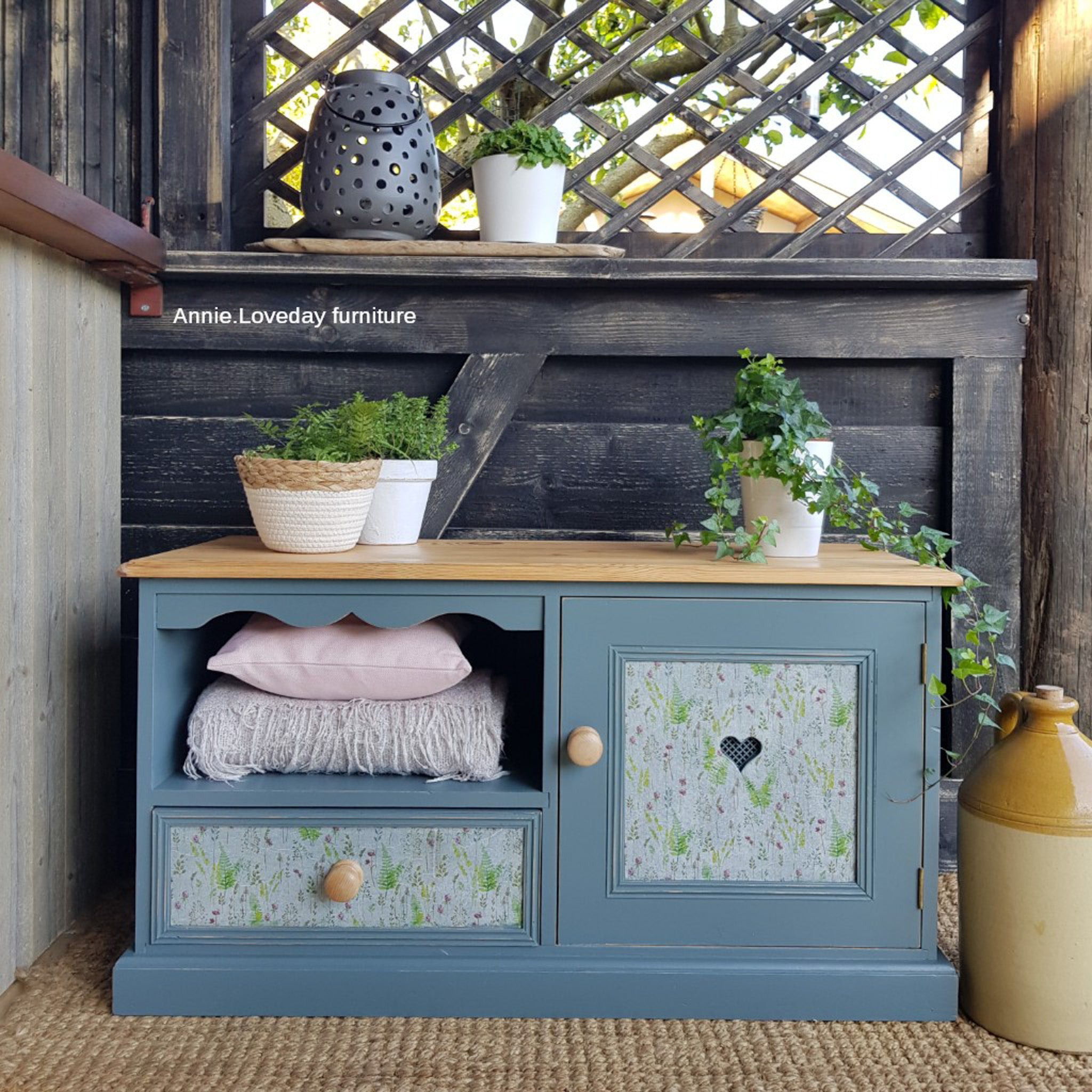 A vintage child-size bench with front-access storage refurbished by Annie Loveday Furniture is painted in Dixie Belle's Stormy Seas chalk mineral paint.