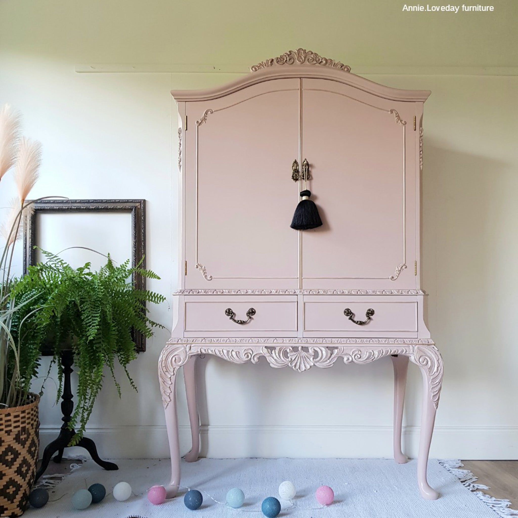 A vintage armoire refurbished by Annie Loveday Furniture is painted in Dixie Belle's Tea Rose chalk mineral paint.