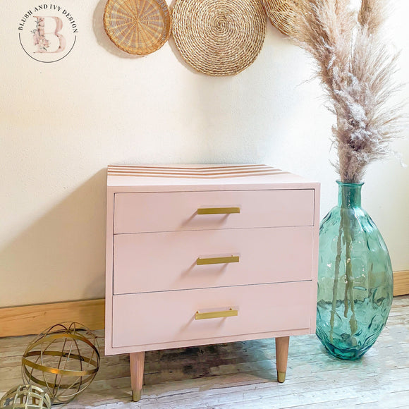 A mid-century 3-drawer nightstand refurbished by Blush and Ivy Design is painted in Dixie Belle's Tea Rose chalk mineral paint.