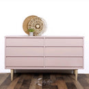 A mid-century 6-drawer dresser refurbished by Lilly Moon Vintage is painted in Dixie Belle's Tea Rose chalk mineral paint.