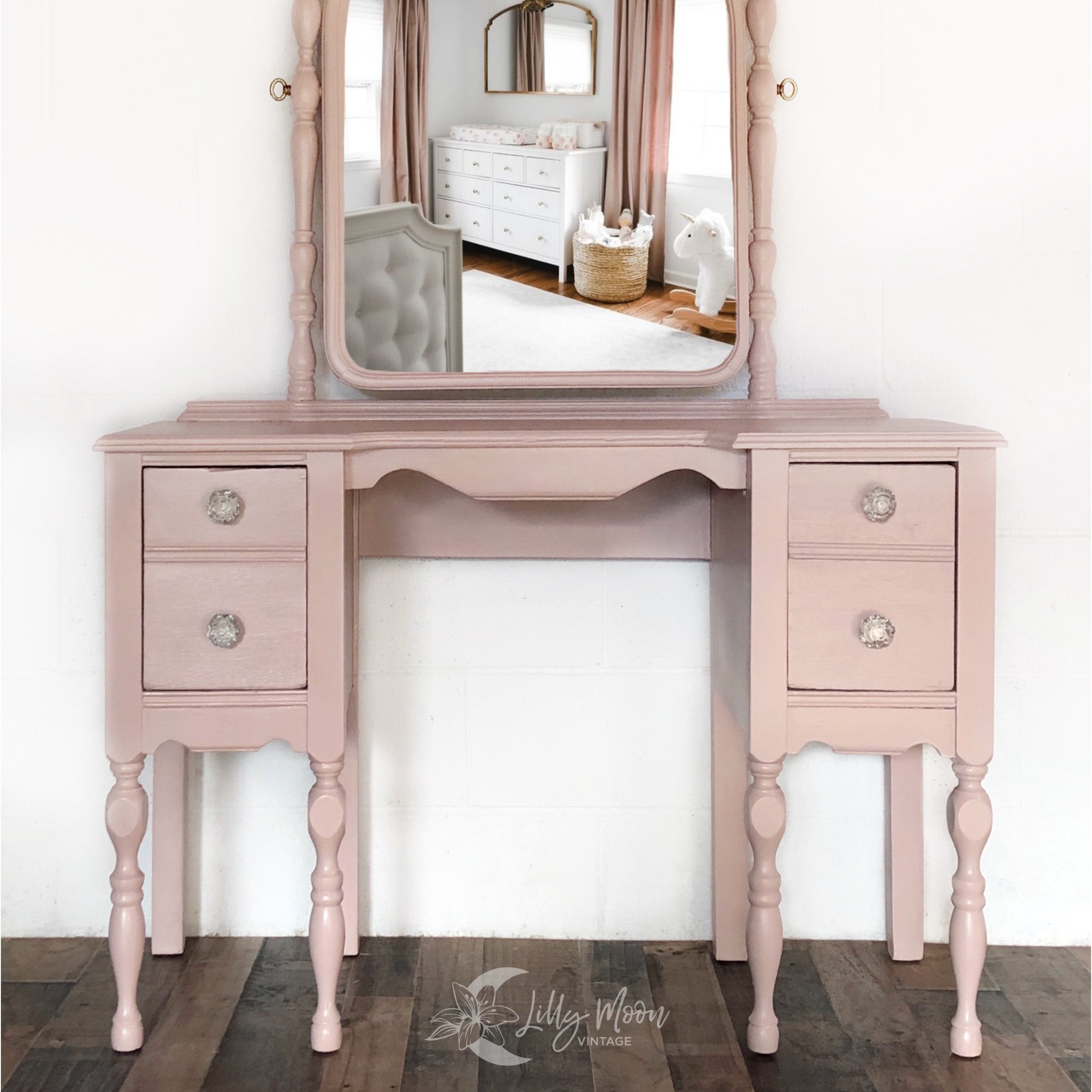 A vintage vanity refurbished by Lilly Moon Vintage is painted in Dixie Belle's Tea Rose chalk mineral paint.