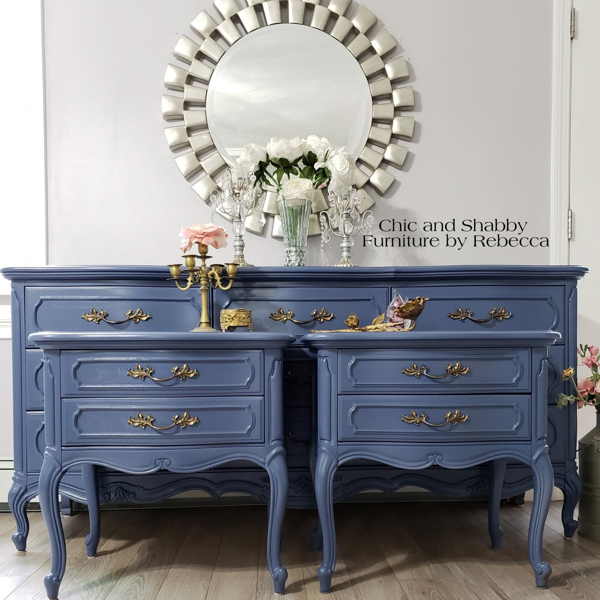 A large vintage 9-drawer dresser and and 2 matching 2-drawer nightstands refurbished by Chic and Shabby Furniture by Rebecca are painted in Dixie Belle's Yankee Blue chalk mineral paint.
