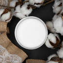 An arial view of an open container of Dixie Belle Paint Company’s Cotton Chalk Mineral Paint is surrounded by real cotton and burlap lace ribbon.