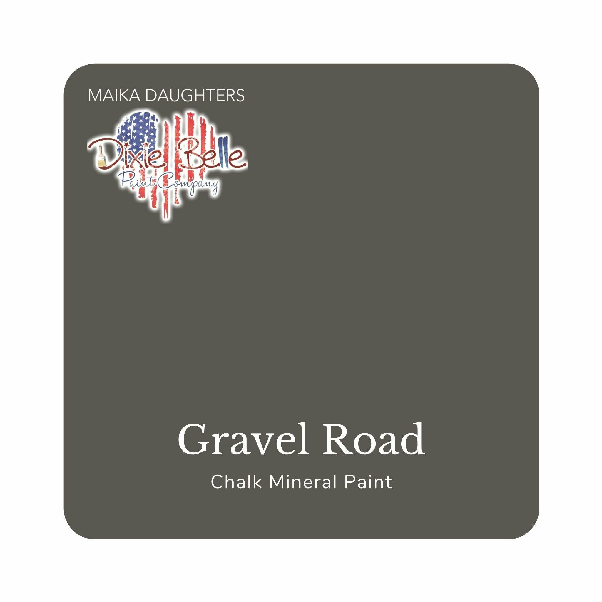A square swatch card of Dixie Belle Paint Company’s Gravel Road Chalk Mineral Paint is against a white background. This color is a rich gray.