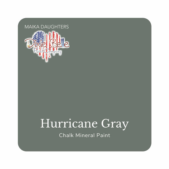 A square swatch card of Dixie Belle Paint Company’s Hurricane Gray Chalk Mineral Paint is against a white background. This color is a dark slate gray.