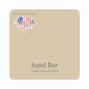 A square swatch card of Dixie Belle Paint Company’s Sand Bar Chalk Mineral Paint is against a white background. This color is a light neutral beige.