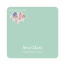 A square swatch card of Dixie Belle Paint Company’s Sea Glass Chalk Mineral Paint is against a white background. This color is a blue light gray.