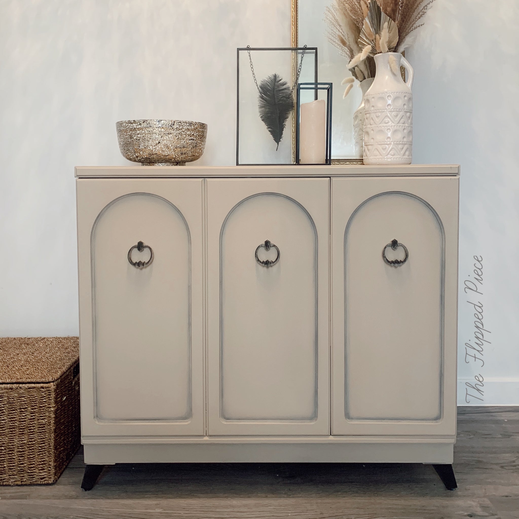 A vintage small buffet table refurbished by The Flipped Piece is painted with Dixie Belle's Burlap chalk mineral paint.