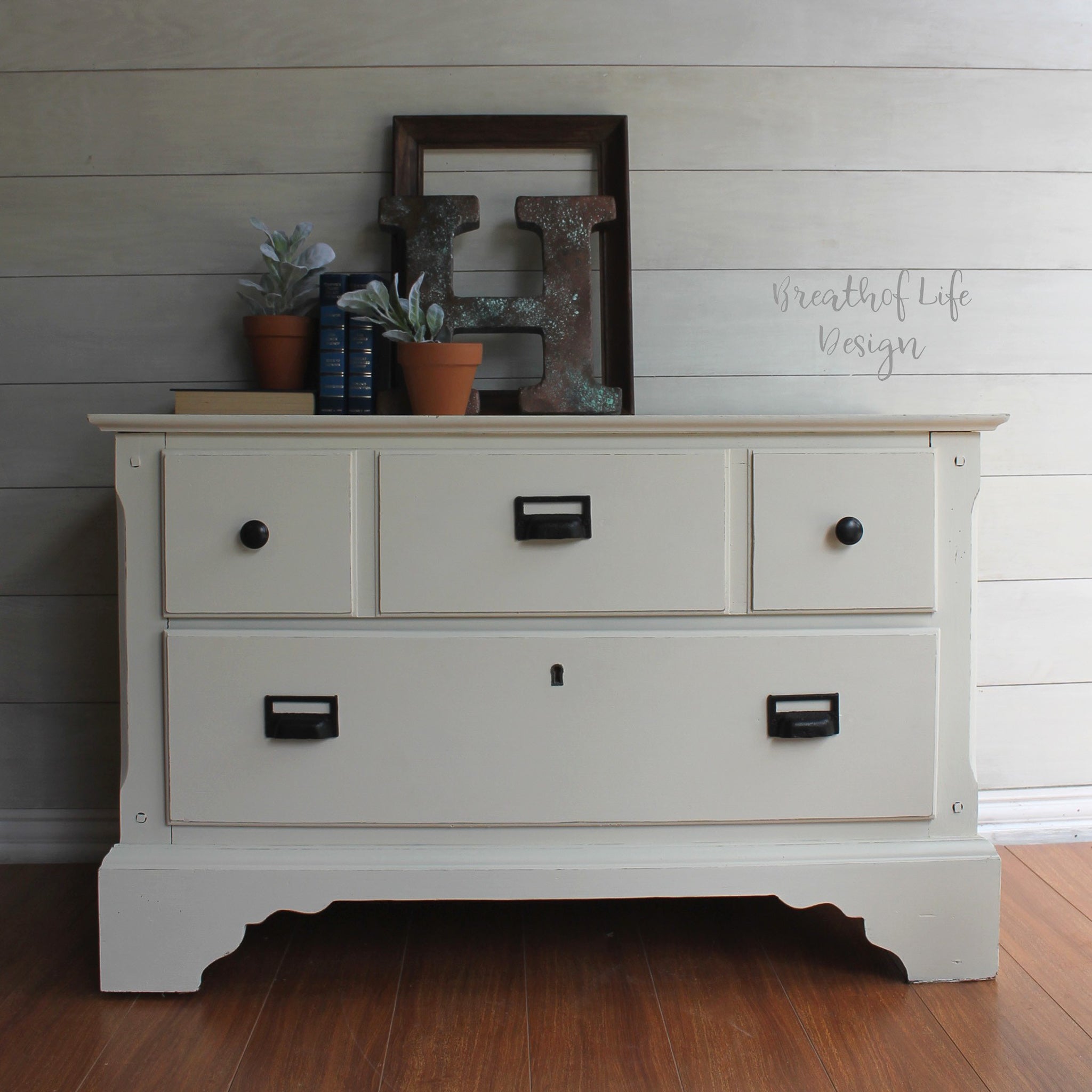 A vintage 2-drawer dresser refurbished by Breath of Life Design is painted in Dixie Belle's Buttercream chalk mineral paint.