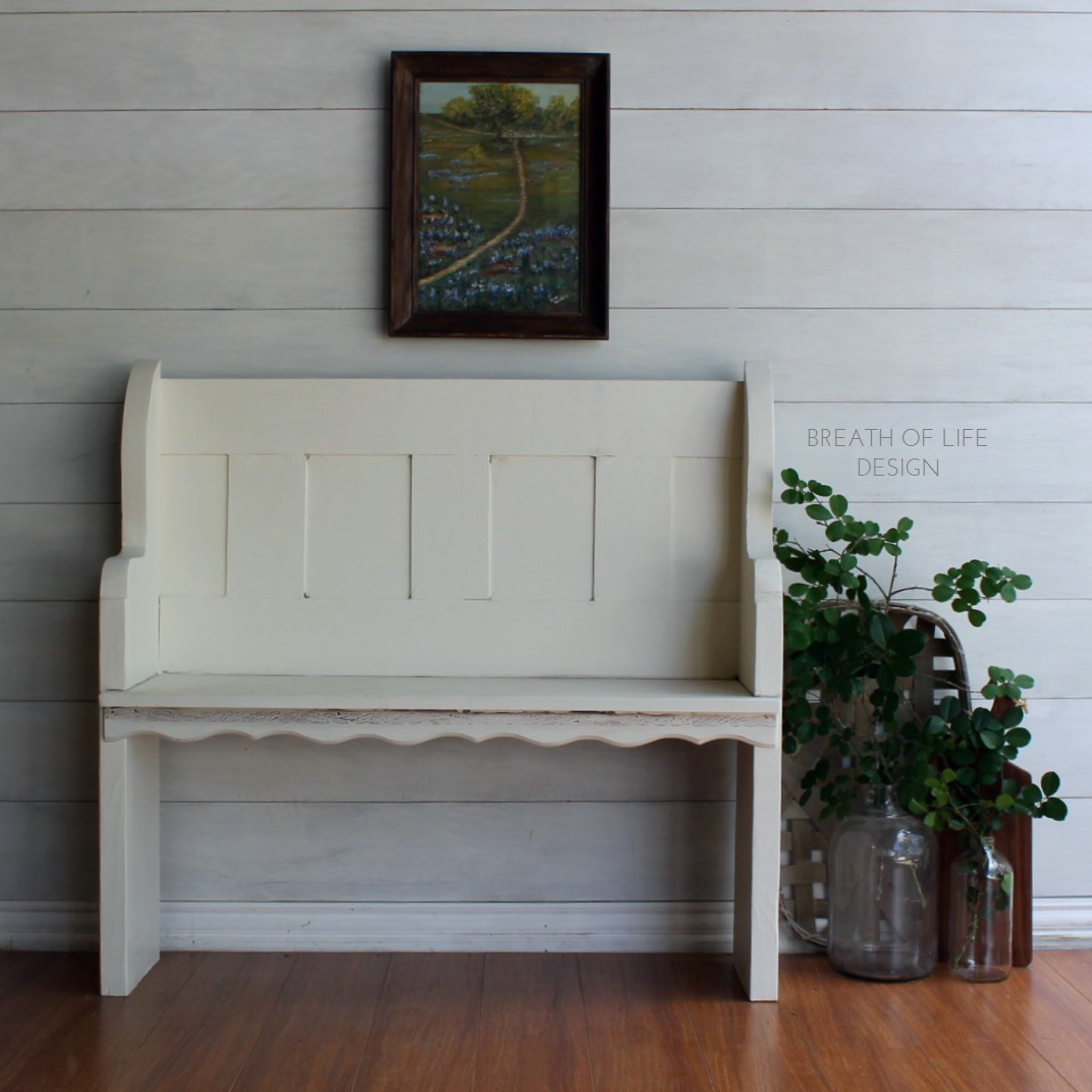 A vintage pew style bench refurbished by Breath of Life Design is painted in Dixie Belle's Buttercream chalk mineral paint.