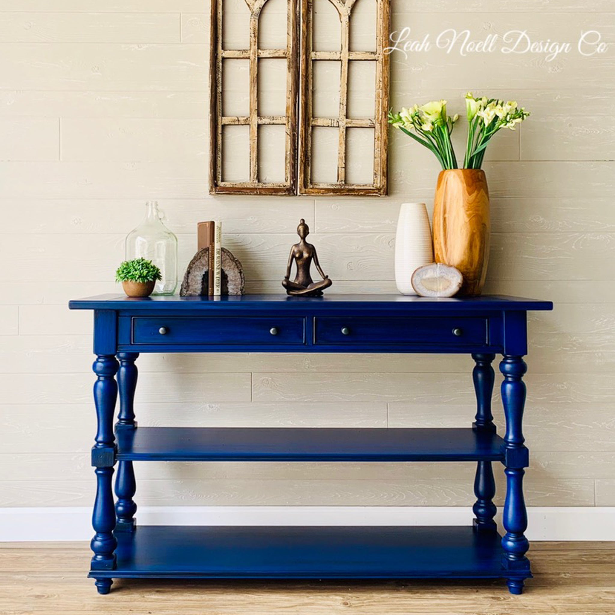 A vintage entryway table refurbished by Leah Noell Design Company is painted with Dixie Belle's Cobalt Blue chalk mineral paint.