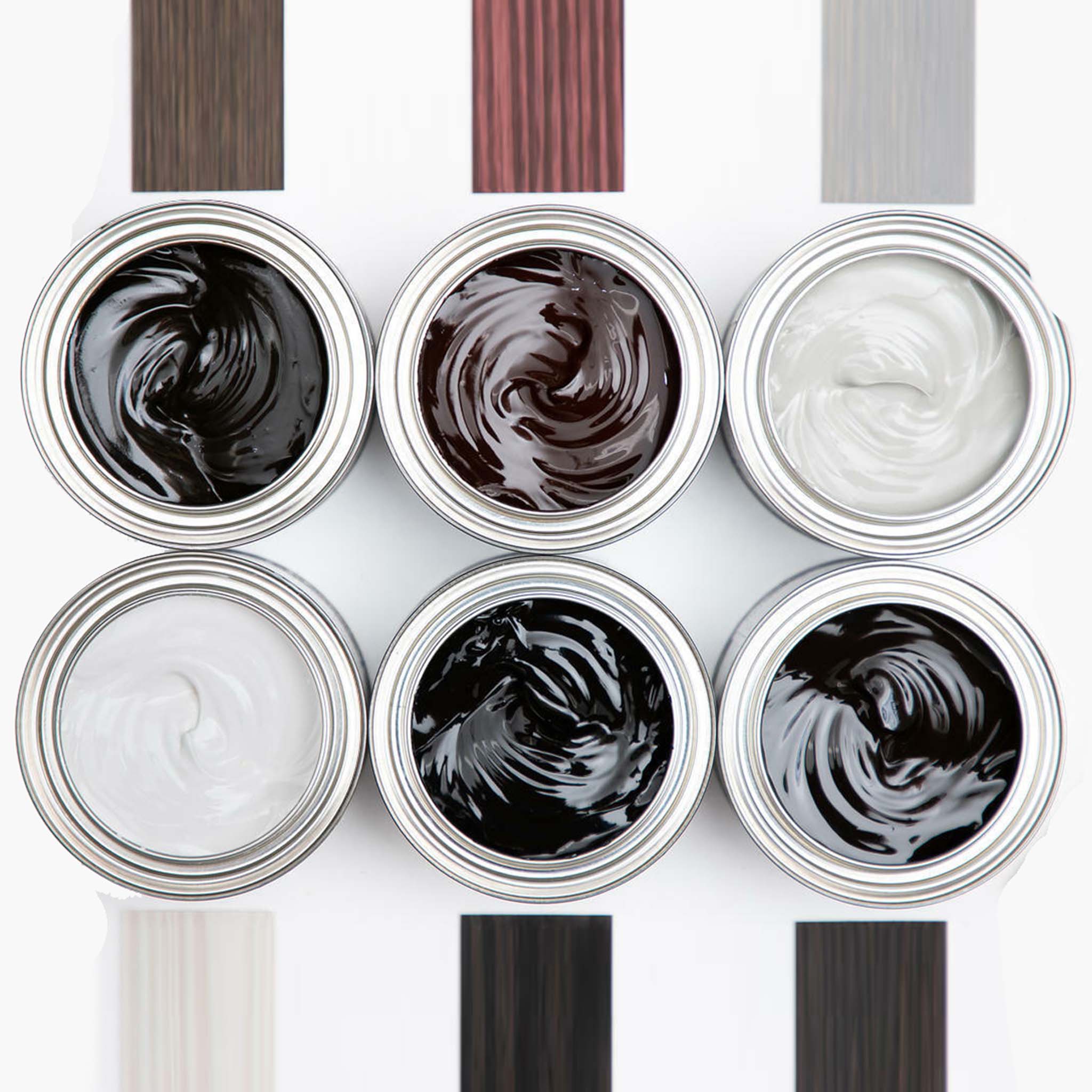 An arial view of six open cans in varying colors of Dixie Belle Paint Company's No Pain Gel Stain and samples of each stain color are against a white background.