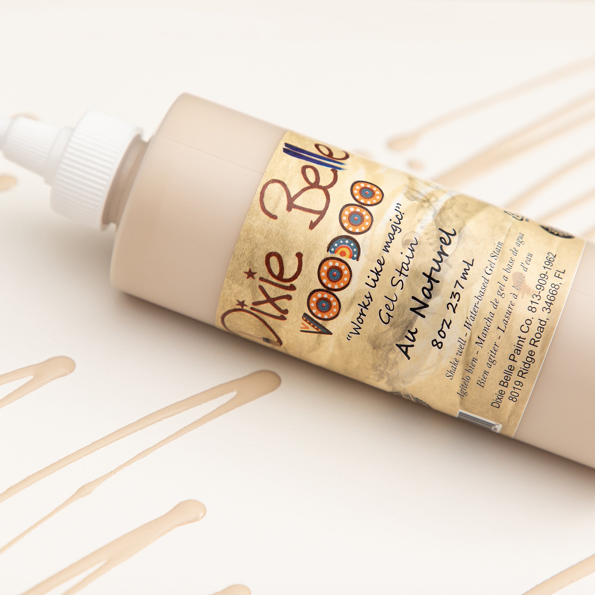 Dixie Belle's Au Naturel Voodoo Gel Stain is against a white background with a poured color sample.