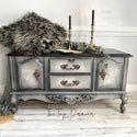 Vintage buffet table refurbished by The Top Drawer is painted in light greys and features an embossed design of the Songbirds stencil on it's 2 doors.