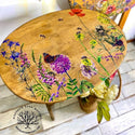 A vintage wood TV tray refurbished by Mustard Tree Market is stained natural wood and features the Wildflowers & Butterflies Transfer on the top.