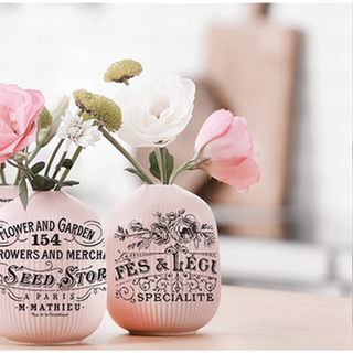 Pink flower filled vase with the Classic Vintage Labels transfer on top.