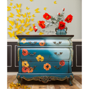 A vintage Bombay style dresser refurbished by Lotus Theory Designs is painted a blend of blue and pale blue with bronze accents and features ReDesign with Prima's Poppy Garden transfer on its drawers.