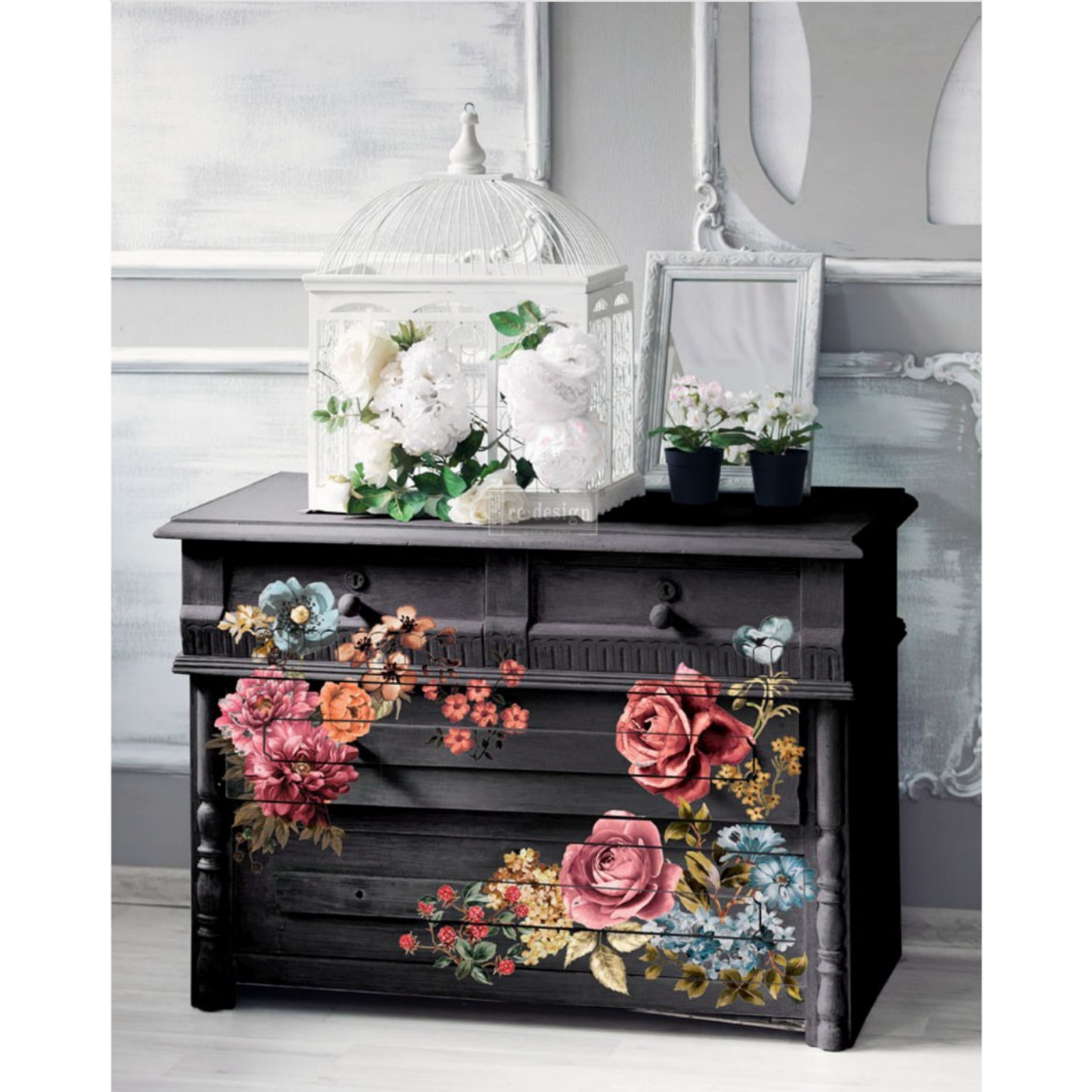 A black dresser features ReDesign with Prima's Ruby Rose on its drawers.